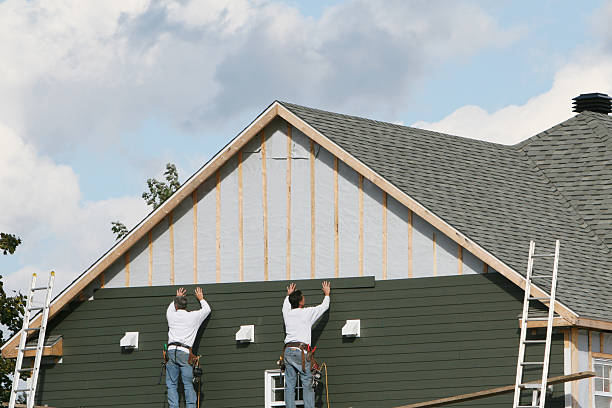 Professional Siding technician working in High Point, FL